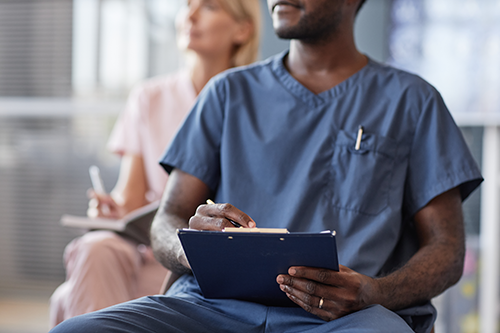 BlogPost4 Nursing professional development session with healthcare professionals taking notes 500px
