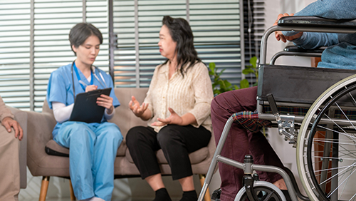 BlogPost4 Parkinsons nursing care consultation with a patient using a wheelchair 500px