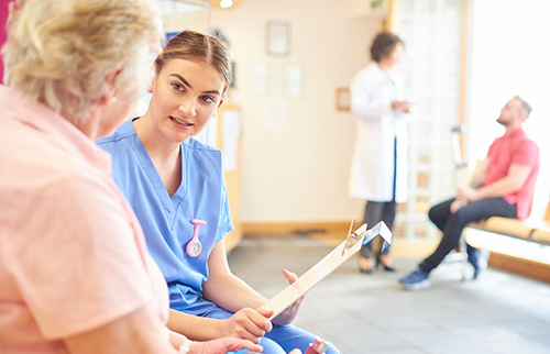 Nurse practitioner talking to the patient